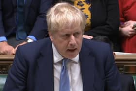 Prime Minister Boris Johnson delivers a statement to MPs in the House of Commons on the Sue Gray report (PA)