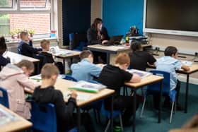 Year five pupils, with their own individual stationery and books in plastic folders, work at their desks at Willowpark Primary Academy in Oldham (Photo by OLI SCARFF/AFP via Getty Images)