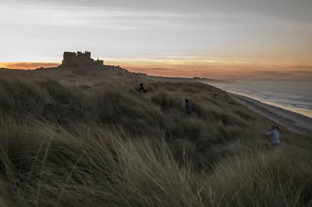 The sun sets behind Bamburgh Castle (Photo: Dan Kitwood/Getty Images)