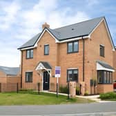 The detached Lavender Way home has a driveway with an electric charging point, adding a practical modern touch to the property
