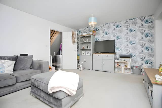 The generous lounge offers a bright and flexible setting for relaxing and entertaining