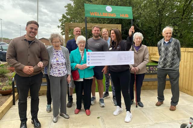 The Reach For Health Centre receive cheque from Overslade House Care Home