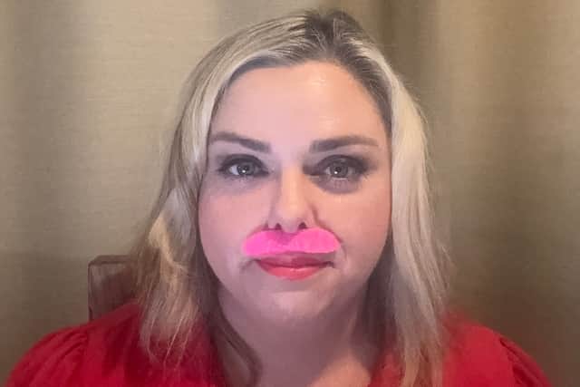 A light-hearted finish to a 21-day challenge. Northamptonshire hypnotherapist Frances B. Lafferty wears a bright pink moustache for her final video, celebrating progress rather than perfection.