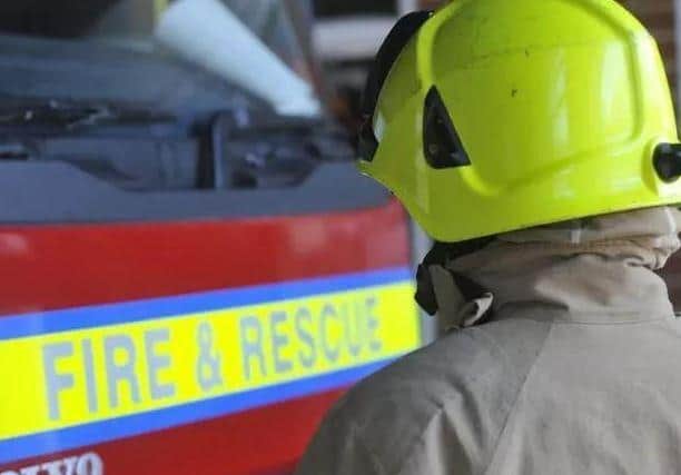 Firefighters cut a trapped driver out of her car on the A428