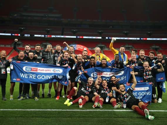 Northampton Town celebrate their stunning Wembley win. Photos: Getty Images