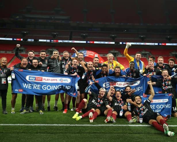 Northampton Town celebrate their stunning Wembley win. Photos: Getty Images