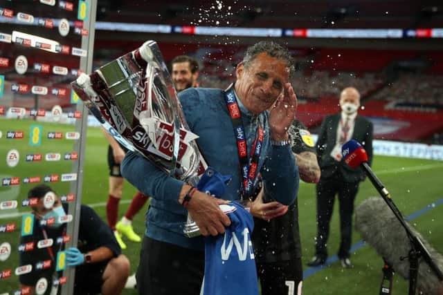 Boss Keith Curle is showed in bubbly in front of the Sky Sports cameras
