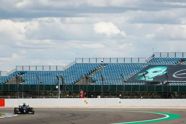 Lewis Hamilton on his way to victory in front of empty grandstands at Silverston. Photo: Getty Images
