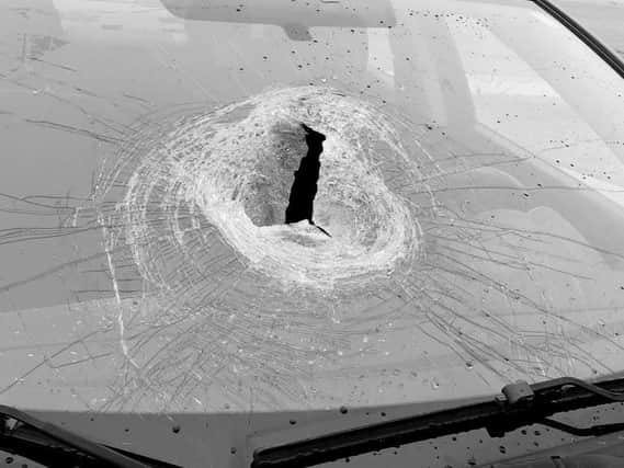 Daventry Police tweeted a photo of a car whose windscreen was smashed by a rock thrown from a bridge