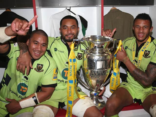 Samu Manoa (centre) with Salesi Ma'afu and Courtney Lawes after Saints claimed Premiership glory in May 2014