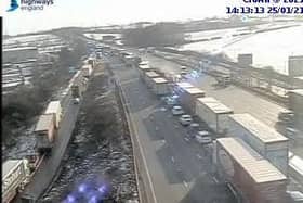 Highways England cameras showed queues building following the lunchtime smash on the M1