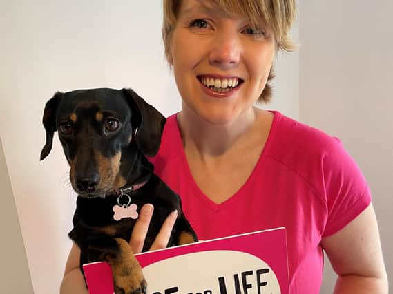 Cancer survivor Heather Duff with her miniature dachshund Parsnip