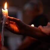 People are being urged to light a candle and stand on their doorsteps at 8pm tonight . Photo: Getty Images