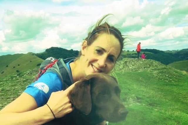 Nell Maddison with her running buddy and pet chocolate Labrador, Maddy