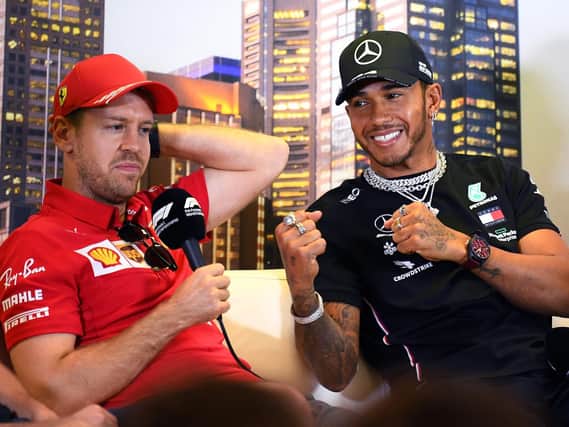 Lewis Hamilton with Sebastian Vettel