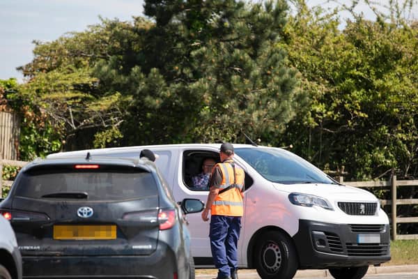 Council staff check vehicles on their way into Sixfields tip today. Photos Leila Coker