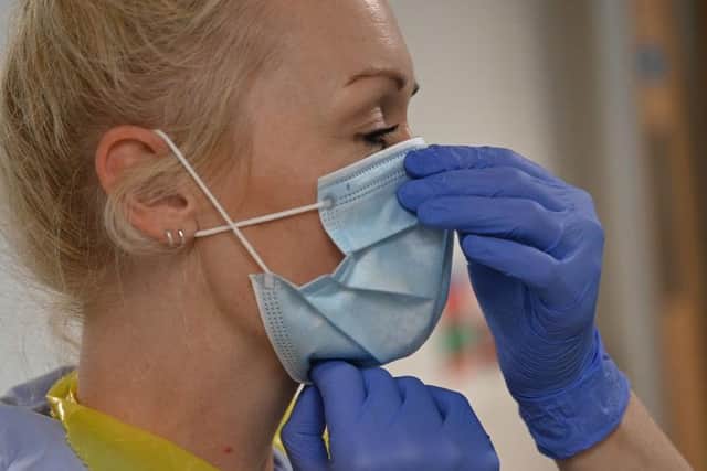 Staff and visitors must wear face masks in hospitals from Monday. Photo Getty Images