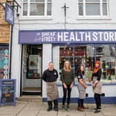 Paula Radcliffe MBE with the friendly team at Sheaf Street Health Store.