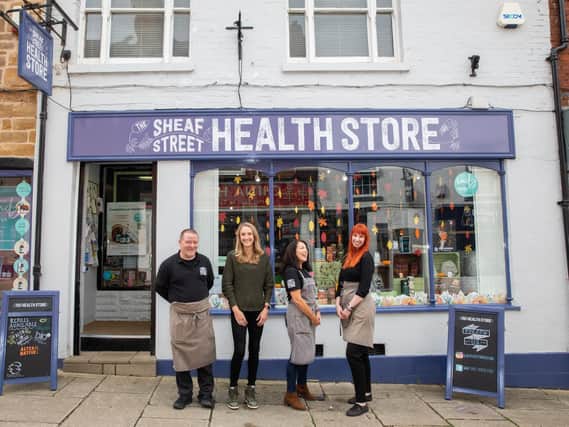 Paula Radcliffe MBE with the friendly team at Sheaf Street Health Store.