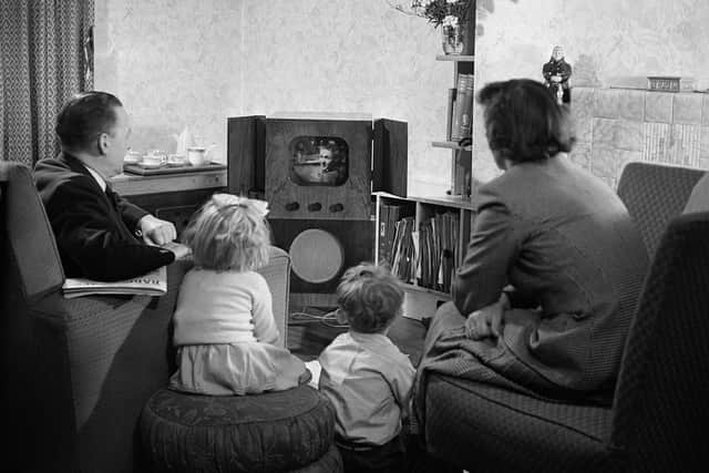 Enjoying the early days of television. Picture: Getty Images.