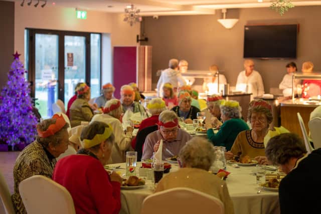 Friends enjoy the Christmas fun at Daventry Town FC.