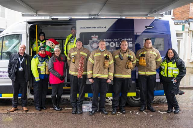 Norm (centre in the woolly hat) at a recent Op Unite event on Daventry High Street.
Picture: Northants Fire