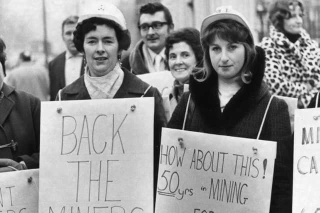 18th January 1972: Miners' wives wearing placards to complain about their husbands' pay and supporting their strike outside the Houses Of Commons in London.