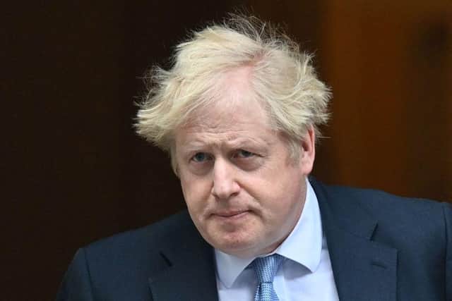 PM Boris Johnson leaves Downing Street before Wednesday's PMQs