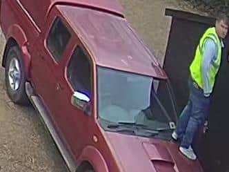 CCTV cameras caught the thief standing on the Nissan truck before smashing a window to roll it out of the way. Photo: Northamptonshire Police