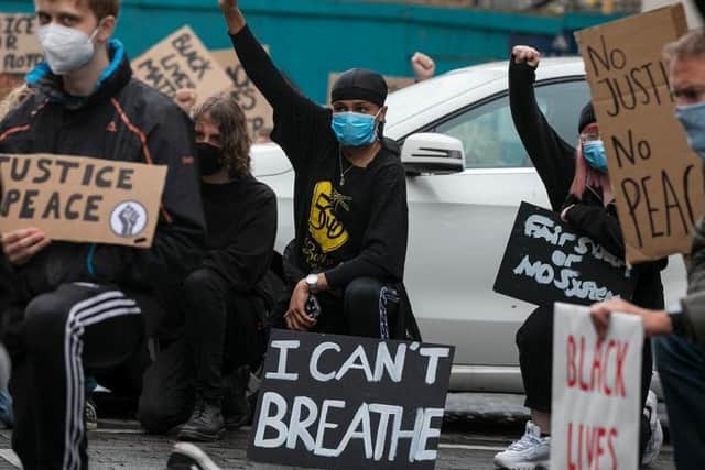 Protesters at the Black Lives Matter march in Northampton in May last year. 'I Can't Breathe' comes from the footage of George Floyd's murder as white police officer knelt on his neck for over nine minutes. Photo: Leila Coker