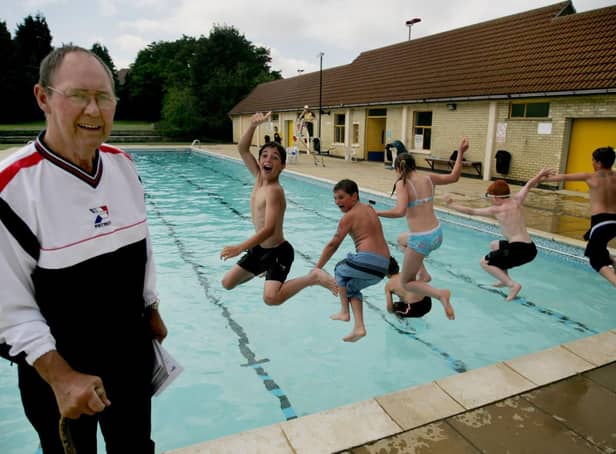 Our library picture of former campaigner BIll Spencer with local children at the pool.