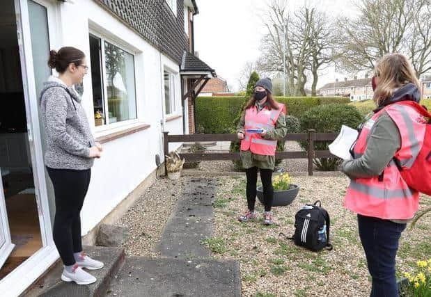 Volunteers went door-to-door delivering test kits during the exercise