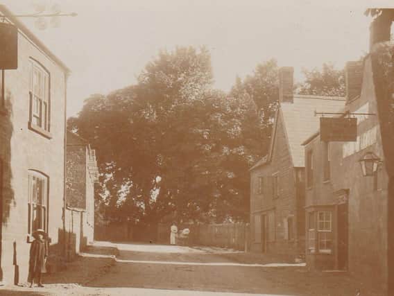 Watford 1906 showing the Henley Arms Pub on the left and The Barley Mow Pub on the right.