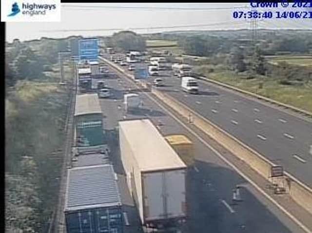 Traffic is crawling on the M1 after a vehicle fire blocked a lane near Northampton