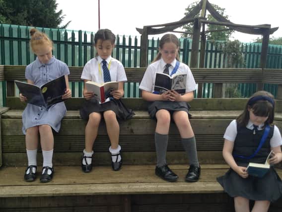 Children at Falconer's Hill enjoy reading.