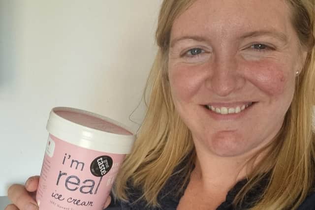 Milly with a pot of I'm Real ice cream.