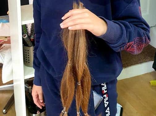 The fundraiser grew her hair to have it chopped off.