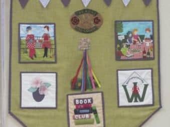 The Flore WI banner carried at the Northampton County Federation of WI's (NCFWI) centenary celebration at Althorpe 2018.