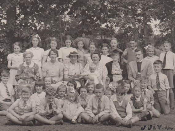 Lyn (front, left) with Sunday School members.