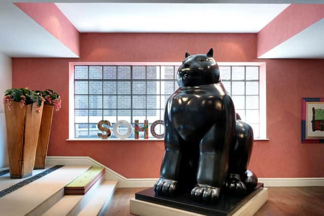 A Botero cat sculpture stands in the hotel's lobby