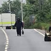 A person in a bomb disposal suit and a robot have been spotted on the A5 near Towcester, which remains closed for a police incident