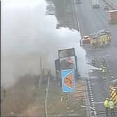 Firefighters tackling the blazing lorry on the M1 on Wednesday morning