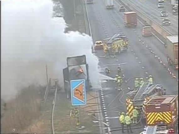 Firefighters tackling the blazing lorry on the M1 on Wednesday morning