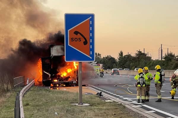Firefighters tackle the blazing lorry on the M1 on Wednesday morning