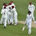 Ben Sanderson is mobbed by Northants team mates after bowling Ben Charlesworth