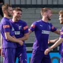 The Daventry players celebrate one of their goals in the 3-1 Easter Monday win at Corby Town. Picture courtesy of Daventry Town FC