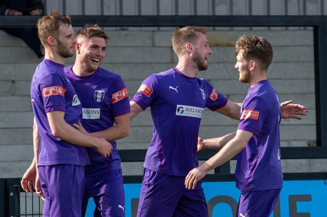 The Daventry players celebrate one of their goals in the 3-1 Easter Monday win at Corby Town. Picture courtesy of Daventry Town FC