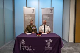 Chief Fire Officer Mark Jones and a member of the Armed Forces Community re-signing the Armed Forces Covenant