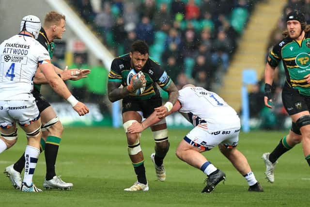 Saints' Courtney Lawes is tackled by Yann Thomas during the Gallagher Premiership Rugby clash against Bristol Bears at Franklin's Gardens