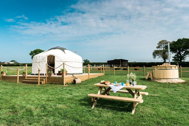 This boutique glamping site is situated in Helmdon, Northamptonshire, and you can choose between a yurt, wagon or tipi in the middle of a wheat field. Hot tubs, king size beds and wood burning stoves are among the luxuries at this destination.
